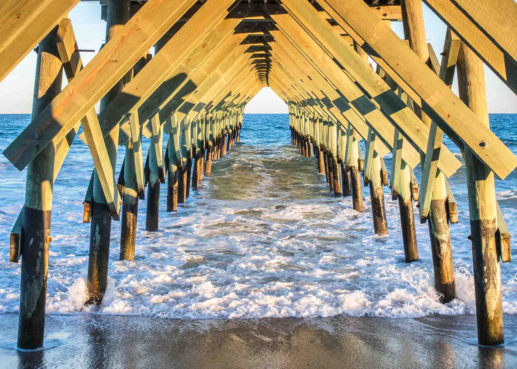 Waters lapping the pier at Wrightsville Beach