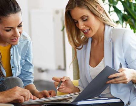 Real estate agent and prospective homeowners meeting