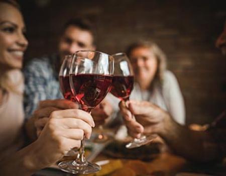 Friends drinking red wine together