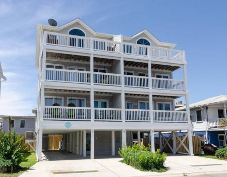 A shot from the beach of Seaside Seagull, a duplex in Wrightsville Beach, N.C. The four levels of the duplex have balconies.