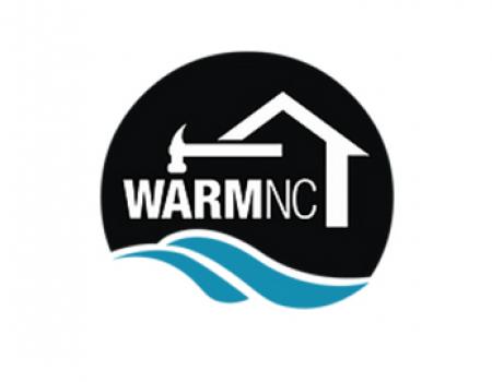 a logo: &quot;Warm NC&quot; in white capital test inside a house graphic and below a hammer graphic. below them, two blue swooshes representing the ocean.