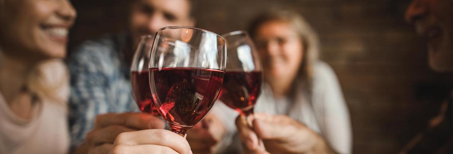 Friends toasting with red wine