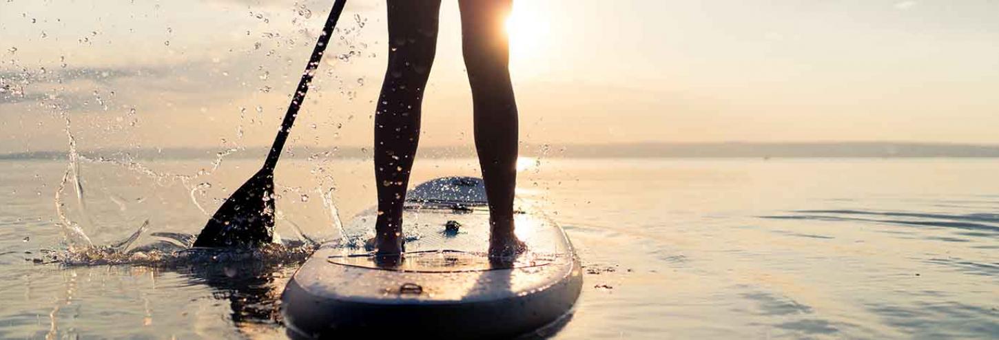 Stand Up Paddle Board racer in the water