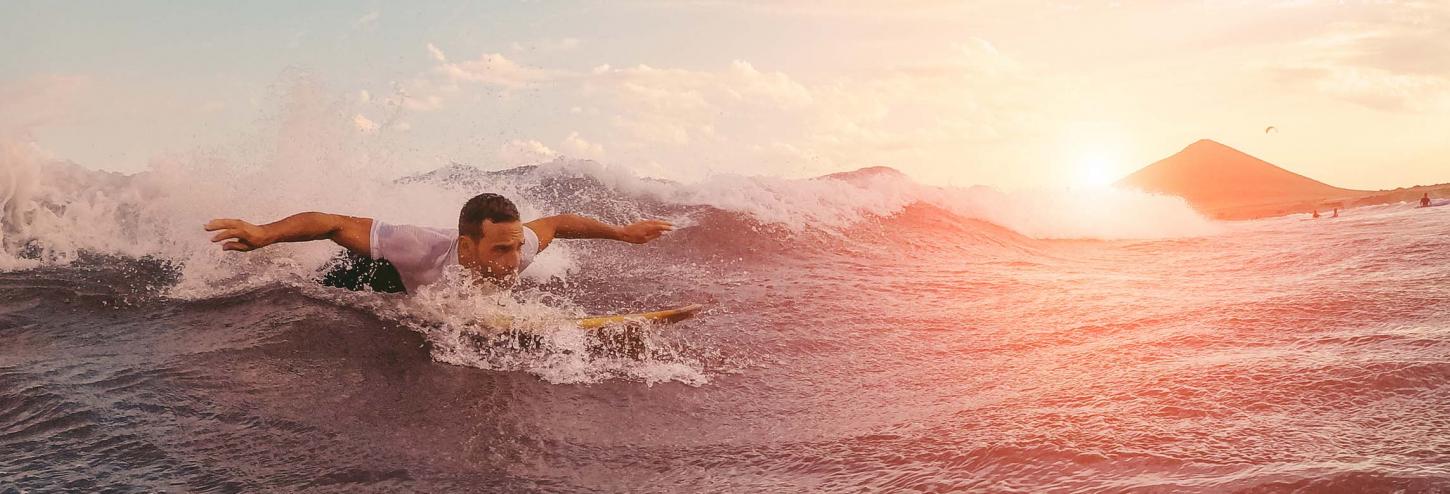 Man on the waves on a longboard