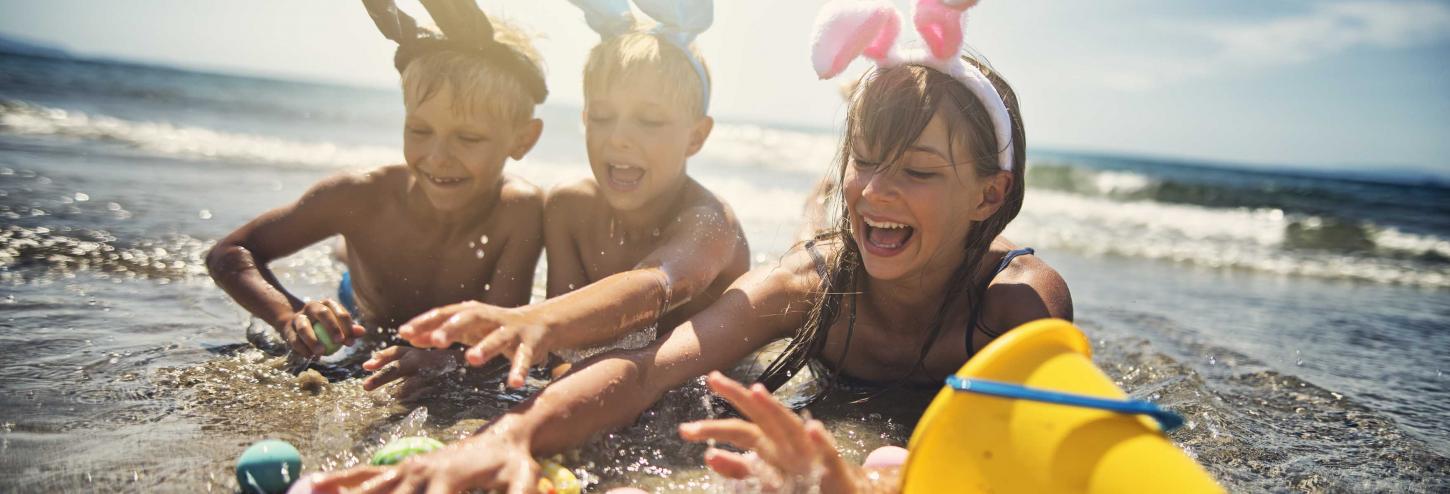 Kids with Easter Eggs on the Beach