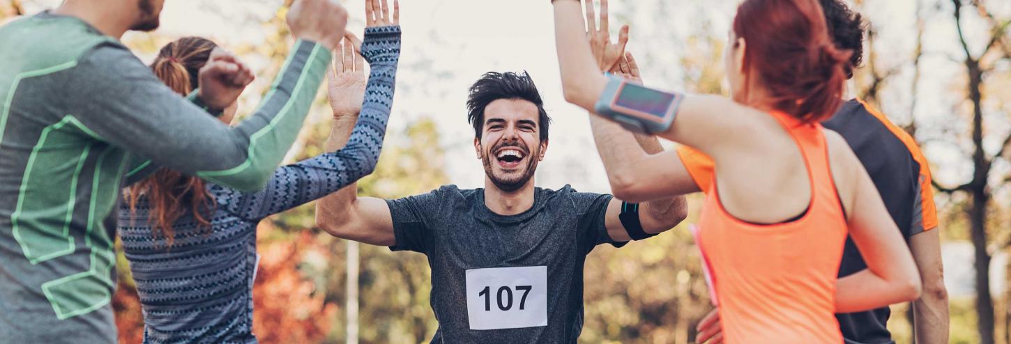 Marathon Runner Getting High-Fives at the Finish Line