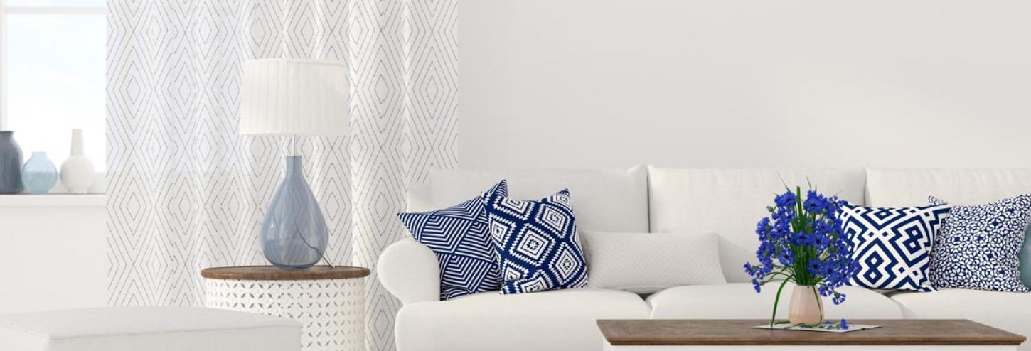 Living room couch with blue pillows