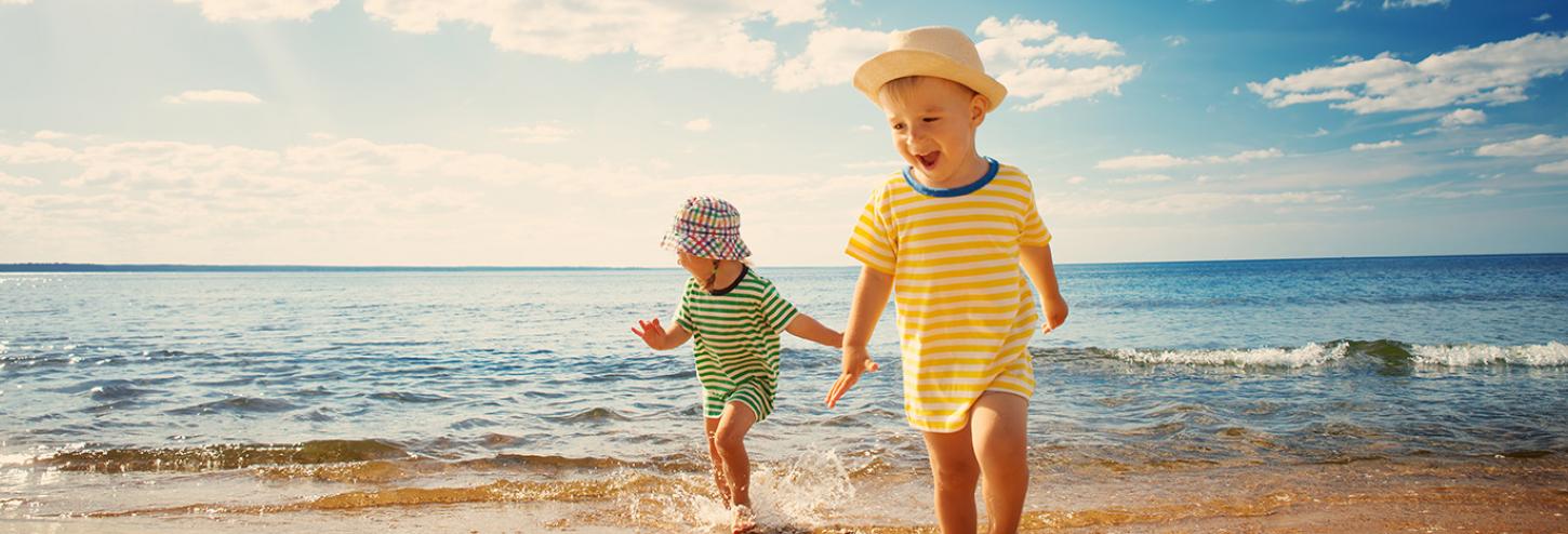 Kids running at the beach