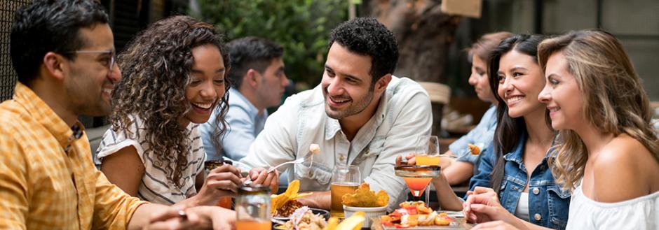 Friends Dining Together at an Outdoor Patio