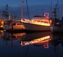 Boat lit up in holiday lights