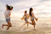 women running on the beach