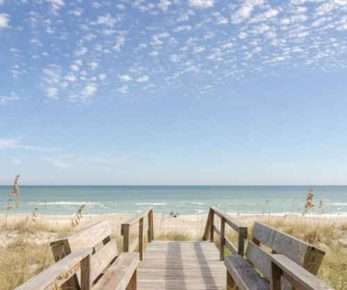 Walking platform leading to Kure Beach access directly from a vacation rental home.