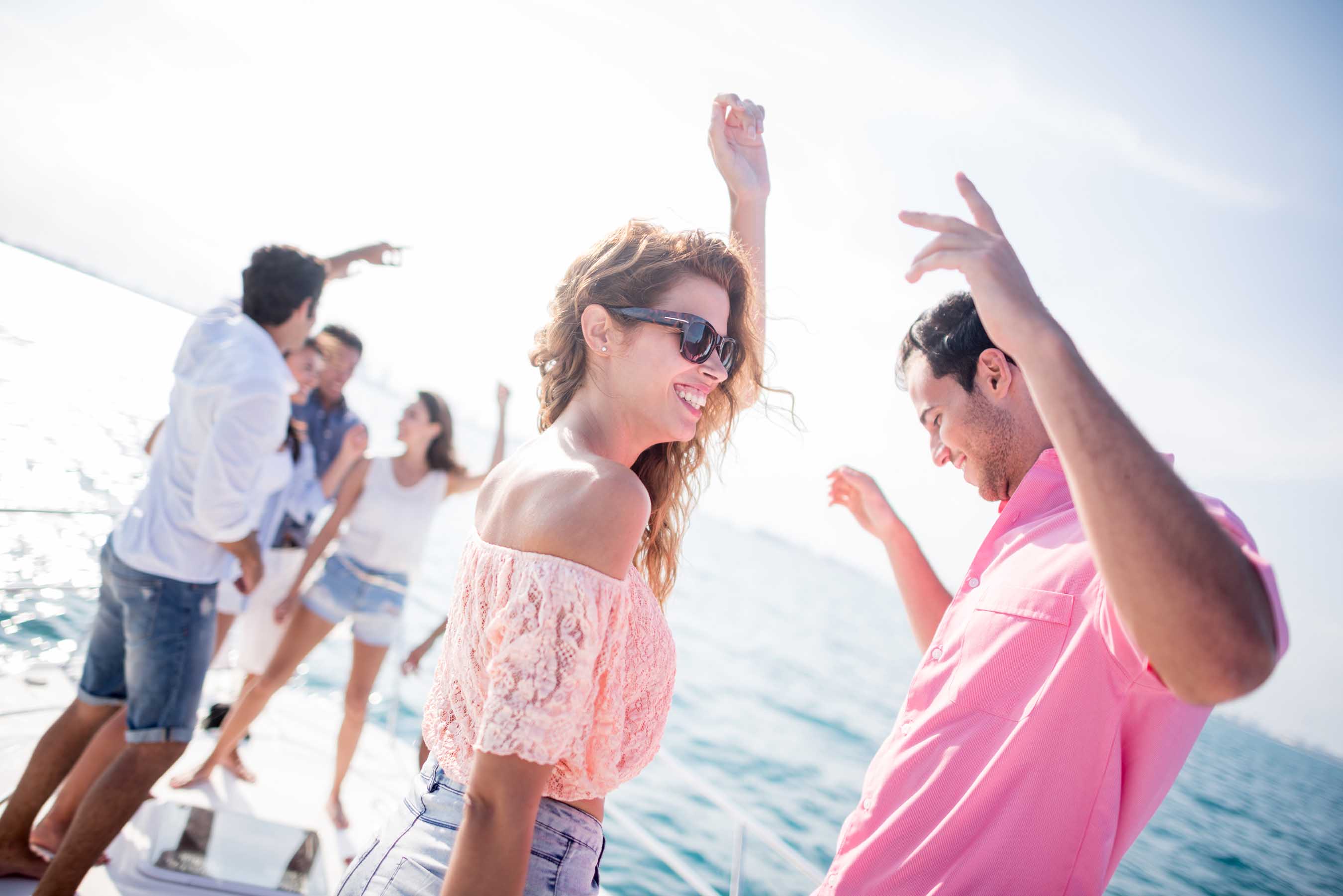 Dancing outside by a yacht