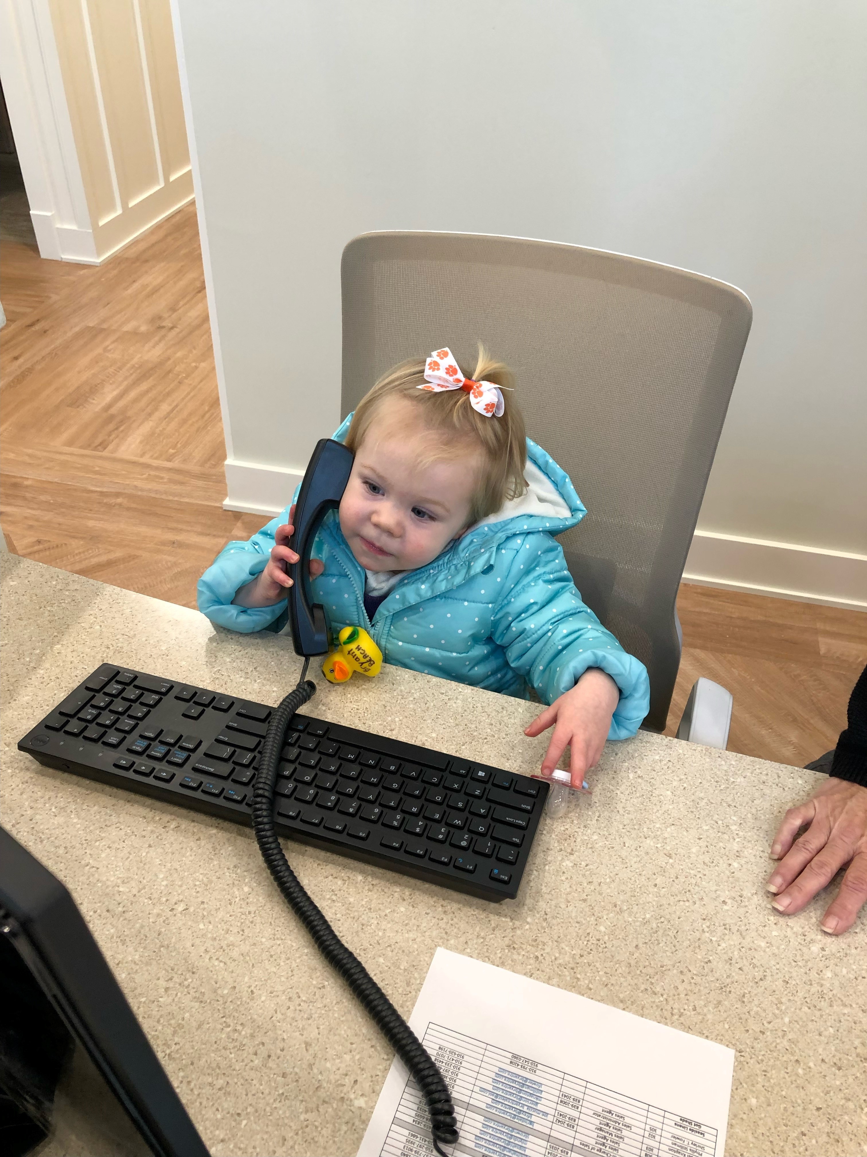 Jason's Daughter Emma Hard at working answering phones at Bryant Real Estate's Carolina Beach office