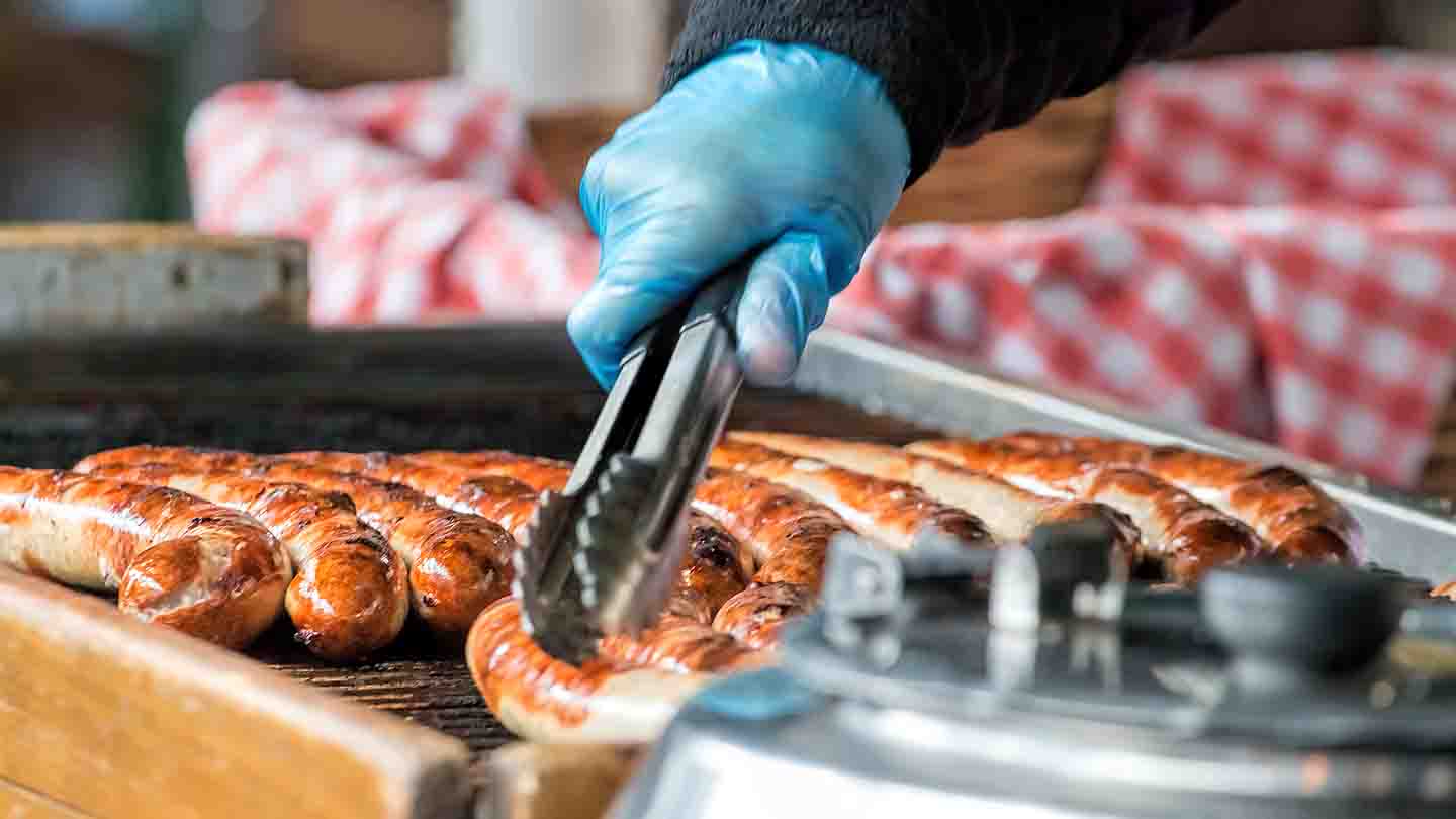 Brats on the grill at a food and wine festival
