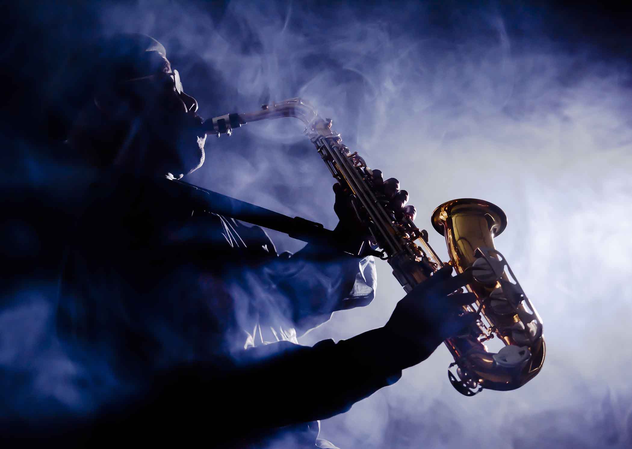 Jazz musician playing with smoke in the air