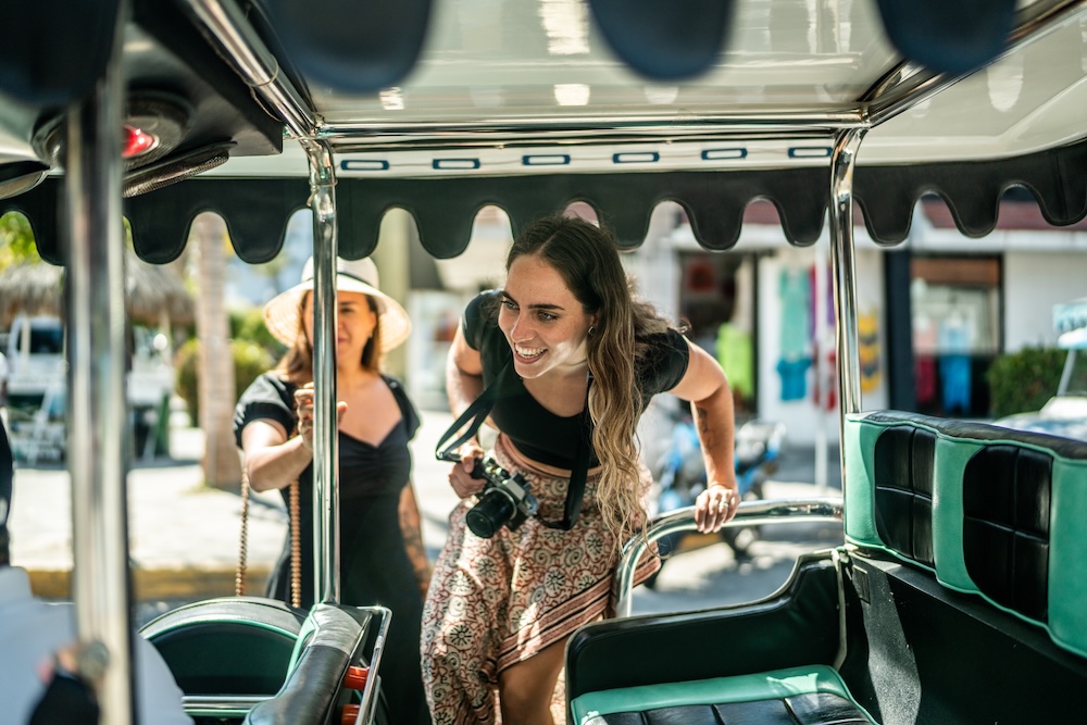 two women getting on a trolley